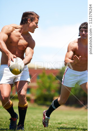 Men, fitness and rugby ball tackle on a field for sports, fun or action, game or power. Energy, handball and topless male friends at a park for competitive, training or summer, workout or challenge Men, fitness and rugby ball tackle on a field for sports, fun or action, game or power. Energy, handball and topless male friends at a park for competitive, training or summer, workout or challenge 112376264