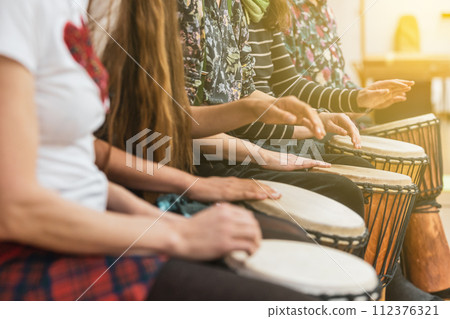 Music therapy concept, a group of people playing different types of musical instruments, music healing 112376321