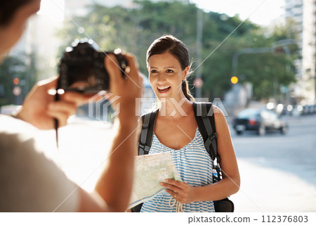 Tourist, woman and photography in street for travel, sightseeing and happiness on holiday and vacation in Brazil. Map, person and smile in city road for explore, directions and journey in urban town Tourist, woman and photography in street for travel, sightseeing and happiness on holiday and vacation in Brazil. Map, person and smile in city road for explore, directions and journey in urban town 112376803