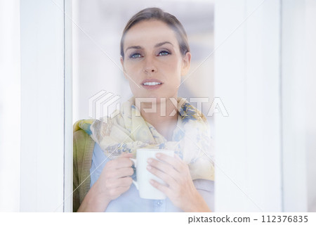 Coffee, thinking and face of woman in window with thoughtful, wondering and relax in home. Morning, breakfast and calm person with glass with mug drinking tea, caffeine and hot beverage in house 112376835