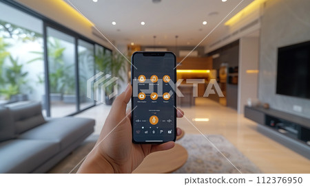 smartphone in hand smart home concept 112376950