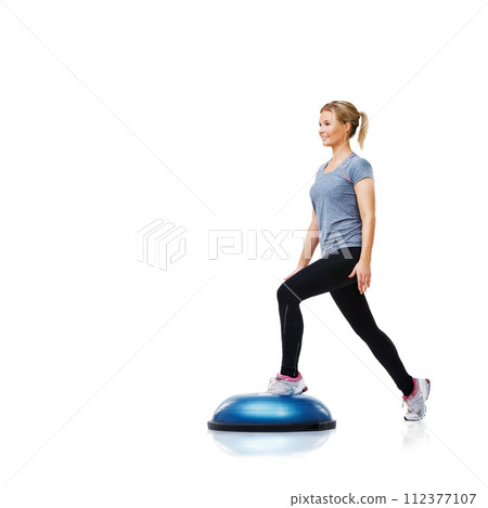 Woman, ball or legs training in workout for body or core development isolated on white background. Athlete, exercise equipment or fitness for studio mockup space, balance challenge or wellness 112377107