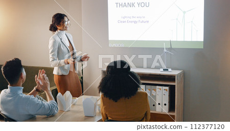 Applause, woman and presentation with workshop, eco friendly and research with corporate training, conference and review. Person, presenter and group with sustainability, feedback and energy seminar 112377120