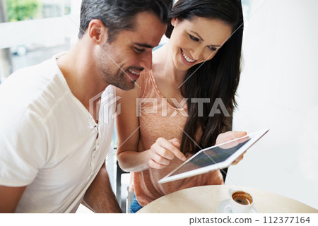 Happy couple, love or tablet in restaurant to relax or bonding together on espresso date on social media. Man, woman or technology for choice in online shopping, cafe or surfing internet on honeymoon 112377164