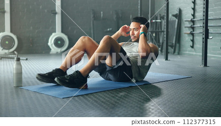 Exercise abdomen training, man and fitness body workout in gym. Young Asian person athlete, healthy sports wellness goal and core muscle power crossfit motivation on yoga mat in health studio 112377315