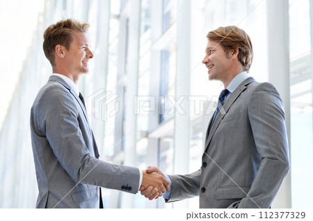 Men, colleagues and shaking hands or business agreement or collaboration on project, deal or promotion. Male people, networking and gesture for partnership at law firm or welcome, onboarding or unity Men, colleagues and shaking hands or business agreement or collaboration on project, deal or promotion. Male people, networking and gesture for partnership at law firm or welcome, onboarding or unity 112377329