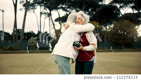 Bowling success, hug and women on a field with teamwork, support and celebration in sport. Happy, win and senior friends excited about a game or competition in a park for retirement hobby together Bowling success, hug and women on a field with teamwork, support and celebration in sport. Happy, win and senior friends excited about a game or competition in a park for retirement hobby together 112378133