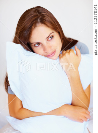 Bedroom, pillow and woman with peace, thinking and calm with freedom, morning and daydreaming. Person, girl and lady with cushion, planning and zen with ideas, home and relax with wellness or healthy 112378141