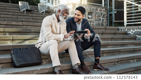 Tablet, conversation and business men in the city in discussion for corporate legal case. Teamwork, collaboration and male attorneys with digital technology sitting and talking on stairs in town. 112378143