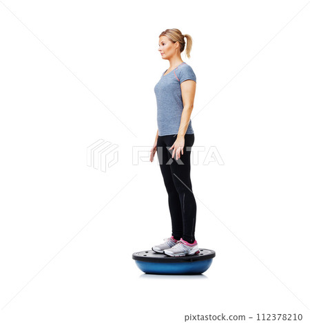 Profile of woman, bosu ball or balance in studio workout performance isolated on white background. Athlete, training equipment or fitness for mockup space, body challenge or exercise for wellness 112378210