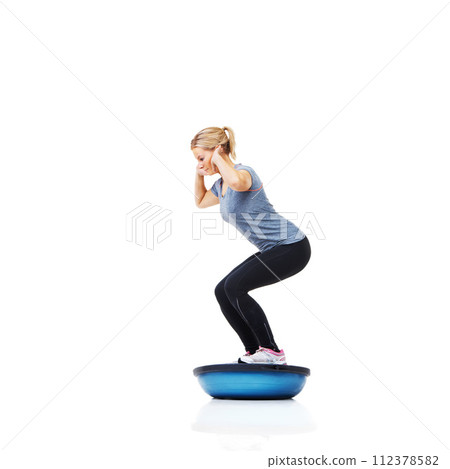 Woman, profile and squat with training, ball or balance for legs, muscle development or studio by white background. Person, exercise and workout for strong healthy body for vision, wellness or health 112378582