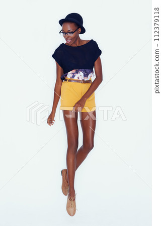 Fashion, jump and black woman on a white background in trendy, stylish and casual clothes. Confidence, hipster style and isolated attractive person with accessory, beauty and happiness in studio Fashion, jump and black woman on a white background in trendy, stylish and casual clothes. Confidence, hipster style and isolated attractive person with accessory, beauty and happiness in studio 112379118