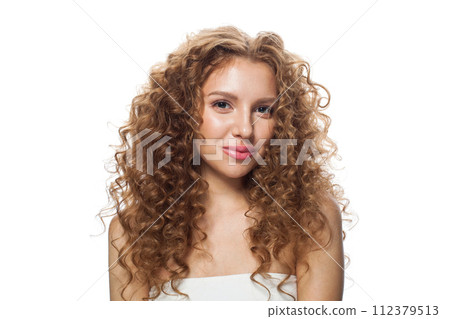 Smiling young healthy lady portrait. Perfect woman with long frizzy hairstyle Smiling young healthy lady portrait. Perfect woman with long frizzy hairstyle 112379513