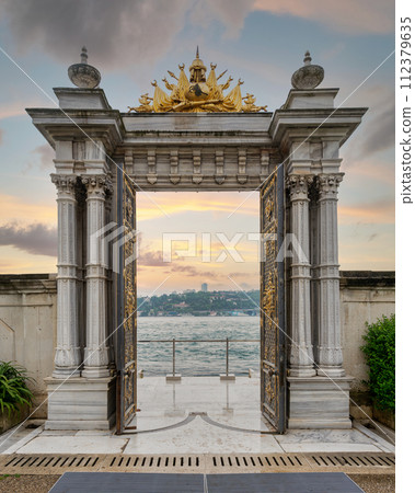 Marble gate with decorated door leading to sea, Beylerbeyi Palace, Istanbul, Turkey 112379635