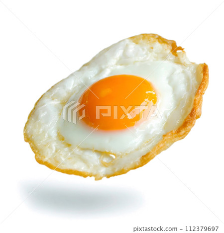 Fried eggs floating in the air on a white background Fried eggs floating in the air on a white background 112379697