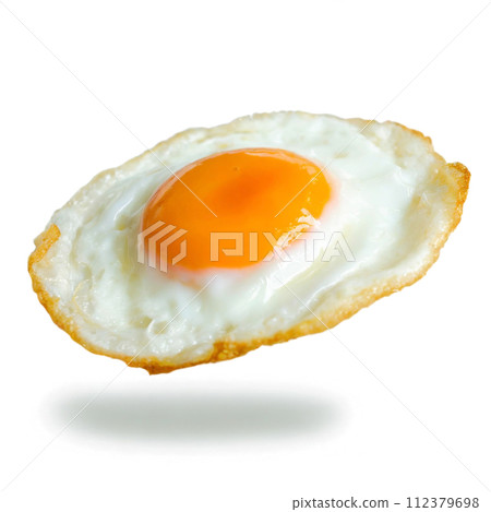 Fried eggs floating in the air on a white background Fried eggs floating in the air on a white background 112379698