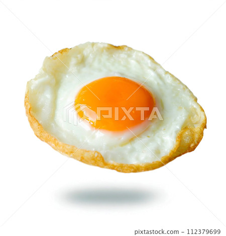 Fried eggs floating in the air on a white background Fried eggs floating in the air on a white background 112379699