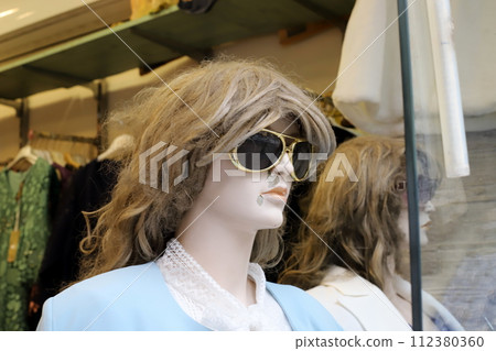 A mannequin stands on a display window in a store in Israel. A mannequin stands on a display window in a store in Israel. 112380360