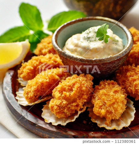 Lots of fried oysters and tartar sauce Lots of fried oysters and tartar sauce 112380361