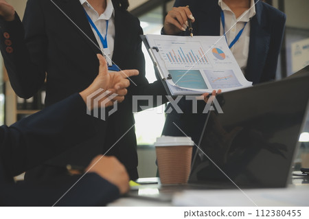 Business team meeting working with new startup project, discussion and analysis data the charts and graphs. Digital tablet, calculator, laptop computer using, Business finance and accounting concept. 112380455