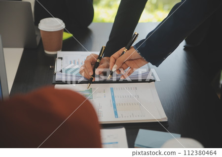 Business team meeting working with new startup project, discussion and analysis data the charts and graphs. Digital tablet, calculator, laptop computer using, Business finance and accounting concept. 112380464