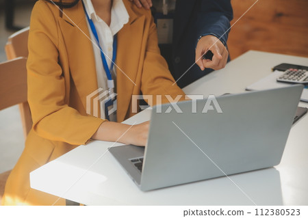 Teamwork with business people analysis cost graph on the desk in the meeting room. The business team discussed meetings and briefing strategies. Negotiation, Analysis, Discussion 112380523