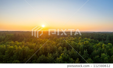 Sunset Glow Over Dense Forest Canopy Sunset Glow Over Dense Forest Canopy 112380612