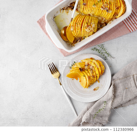 Baked in slices pumpkin top view, copy space Baked in slices pumpkin top view, copy space 112380966