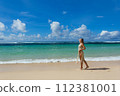 Beautiful young woman on the background of the Bali island sea 112381001