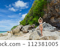 Beautiful young woman in a swimsuit in Bali 112381005