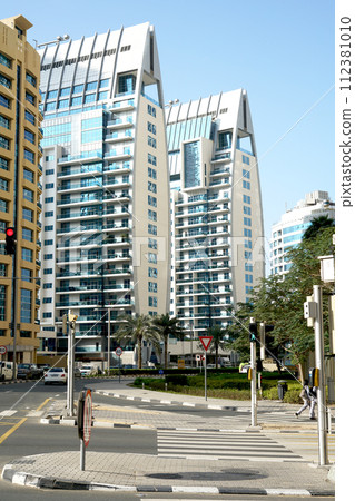Modern skyscrapers and embankment in famous Dubai Marina. 112381010