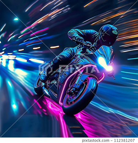 A biker on a motorcycle rides through the night city 112381207