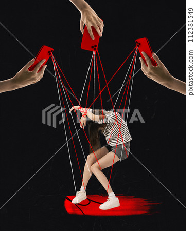 Contemporary art collage. Strings protruding from mobile cameras control depressed girl like puppet against black background. Contemporary art collage. Strings protruding from mobile cameras control depressed girl like puppet against black background. 112381549