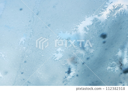 Close Up of Window With Snow Flakes 112382318