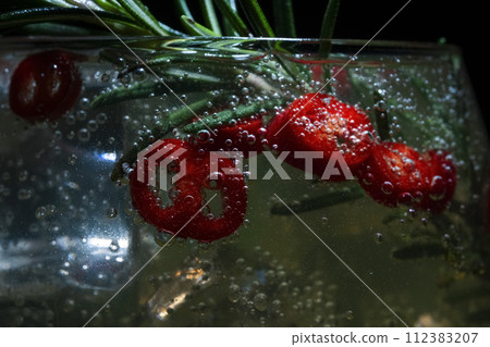 alcoholic cocktail with rosemary and pepperoni alcoholic cocktail with rosemary and pepperoni 112383207
