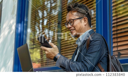 AI-generated content. The young busy smart serious Asian Japanese businessman executive is holding a cellphone device using a mobile cell phone and looking at a smartphone while working in a corporate AI-generated content. The young busy smart serious Asian Japanese businessman executive is holding a cellphone device using a mobile cell phone and looking at a smartphone while working in a corporate 112383840