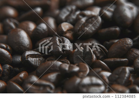 Coffee beans background. Brown roasted coffee beans. Closeup shot of coffee beans. coffee beans. 112384085