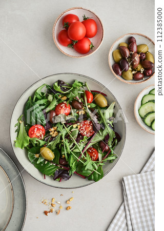 Salad with cherry tomato,  olives, cucumber and arugula 112385000