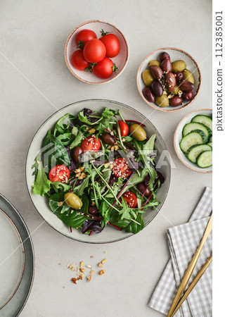 Salad with cherry tomato,  olives, cucumber and arugula 112385001