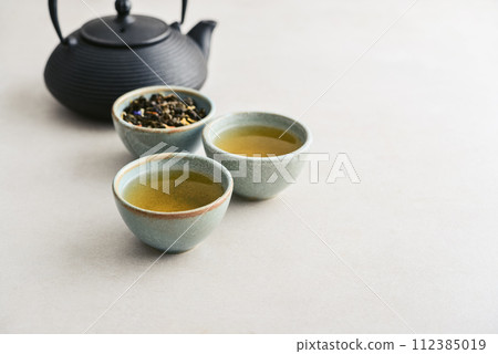 two ceramic cups of green tea two ceramic cups of green tea 112385019