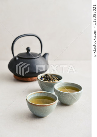 two ceramic cups of green tea 112385021