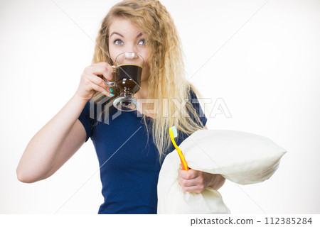 Funny woman being late drinking coffee 112385284