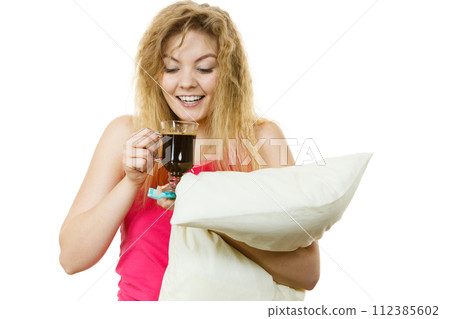 Happy woman holding toothbrush and coffee Happy woman holding toothbrush and coffee 112385602