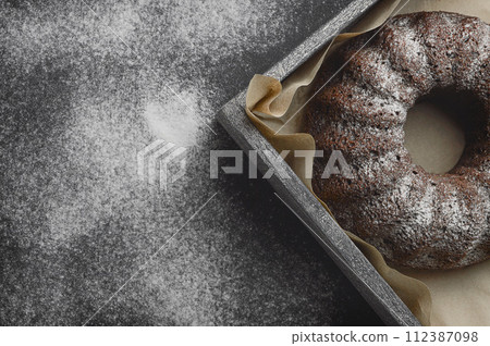 Homemade round cake ,making holiday cakes and desserts. cake and flour. Top view. Copy space. 112387098