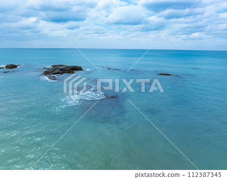 Amazing nature seashore landscape background,Aerial view waves crashing on beach ocean background Amazing nature seashore landscape background,Aerial view waves crashing on beach ocean background 112387345