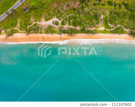 Bird eye view seashore with wave crashing on sandy shore. Beautiful waves sea surface in sunny day summer background, Amazing seascape top view seacoast landscape view Bird eye view seashore with wave crashing on sandy shore. Beautiful waves sea surface in sunny day summer background, Amazing seascape top view seacoast landscape view 112387602