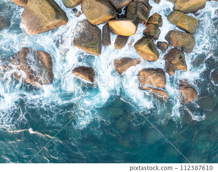 Amazing tropical seashore landscape background,Top view waves crashing on rocks 112387610