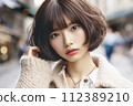 street snapshot image of beautiful young Asian woman with short bob haircut 112389210