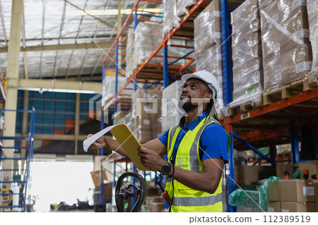 Warehouse industrial stock storage, Man African American worker wear safety uniform checklist stock 112389519