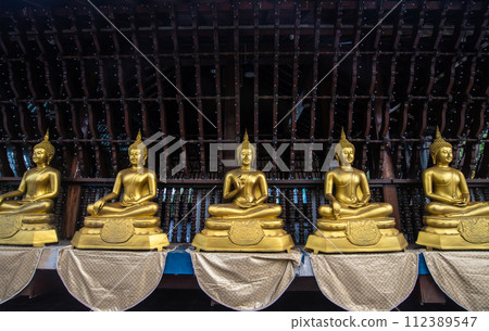 Rows of golden Buddha statue in Seema Malaka buddhist temple on Beira Lake in Colombo, Sri Lanka. Colombo is the commercial capital and largest city of Sri Lanka. Rows of golden Buddha statue in Seema Malaka buddhist temple on Beira Lake in Colombo, Sri Lanka. Colombo is the commercial capital and largest city of Sri Lanka. 112389547